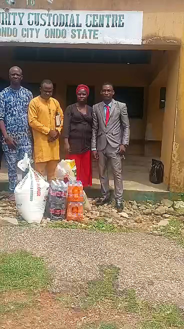 The Goodnews Citadel Ministries team with donated food items at the Medium Security Custodial Centre, Ondo City